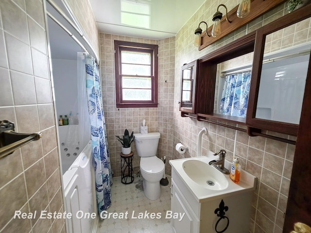 1520 Coolidge Ave, Saginaw, MI 48638 - full bathroom featuring tile walls, vanity, a combined bath / shower with jetted tub, and tile patterned flooring