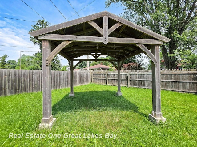 1520 Coolidge Ave, Saginaw, MI 48638 - fenced backyard featuring a gazebo