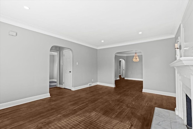18603 Monica St, Detroit, MI 48221 - unfurnished living room with recessed lighting, arched walkways, wood finished floors, baseboards, and a fireplace with flush hearth