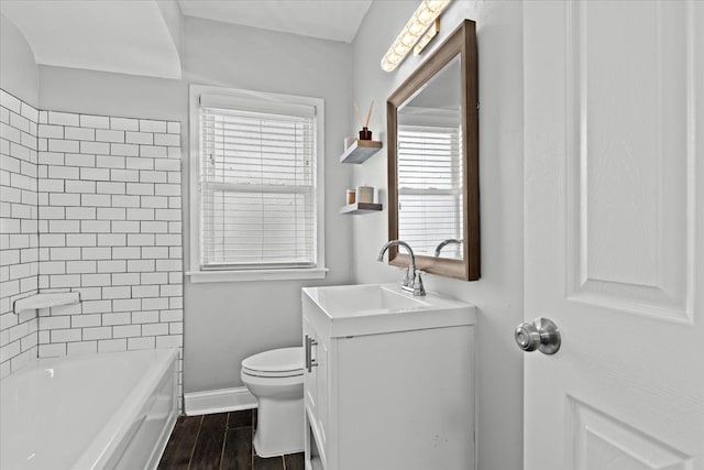 18603 Monica St, Detroit, MI 48221 - bathroom with toilet, wood finished floors, vanity, and baseboards