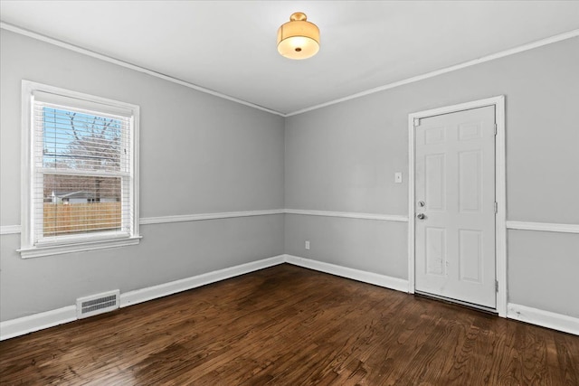 18603 Monica St, Detroit, MI 48221 - spare room featuring crown molding, visible vents, baseboards, and dark wood finished floors