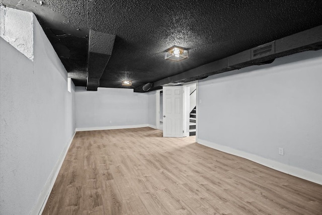 18603 Monica St, Detroit, MI 48221 - finished basement featuring stairs, visible vents, wood finished floors, and baseboards