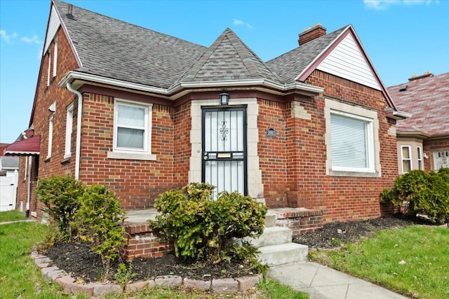 18603 Monica St, Detroit, MI 48221 - view of front facade with brick siding and roof with shingles