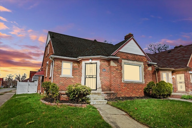 18603 Monica St, Detroit, MI 48221 - view of front of property featuring a front yard, a chimney, a gate, and brick siding