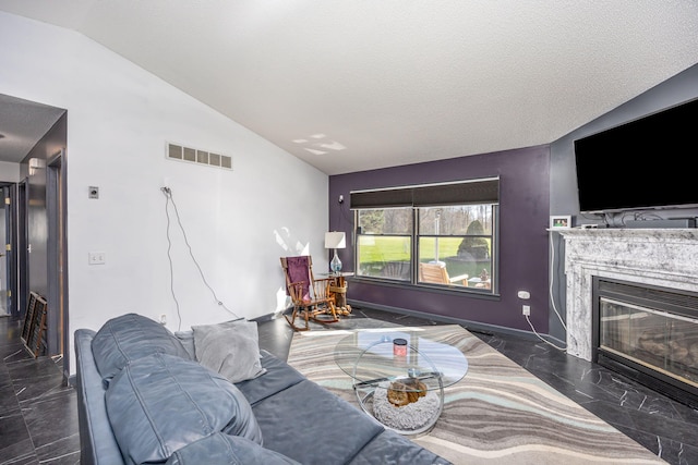 7364 Regency Ln, Canadian Lakes, MI 49346 - living room featuring a premium fireplace, visible vents, lofted ceiling, and marble finish floor
