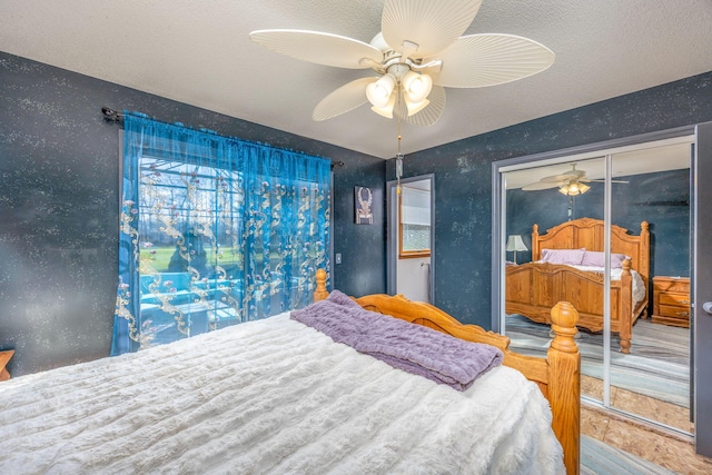 7364 Regency Ln, Canadian Lakes, MI 49346 - bedroom featuring a ceiling fan and a textured ceiling