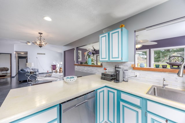 7364 Regency Ln, Canadian Lakes, MI 49346 - kitchen featuring visible vents, tasteful backsplash, dishwasher, light countertops, and ceiling fan with notable chandelier