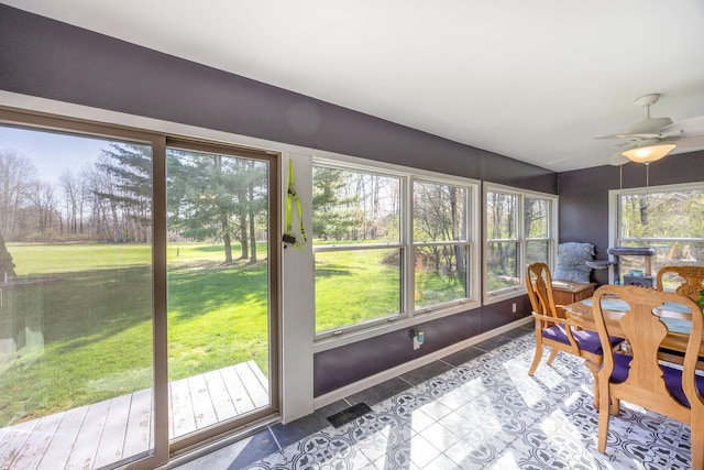 7364 Regency Ln, Canadian Lakes, MI 49346 - sunroom featuring tile patterned floors and baseboards