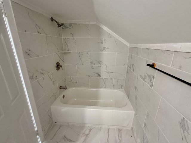 full bath featuring tub / shower combination, tile walls, and marble finish floor