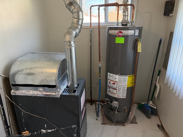 utility room featuring water heater