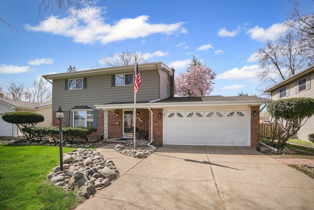 traditional home featuring brick siding, a garage, a front yard, and concrete driveway