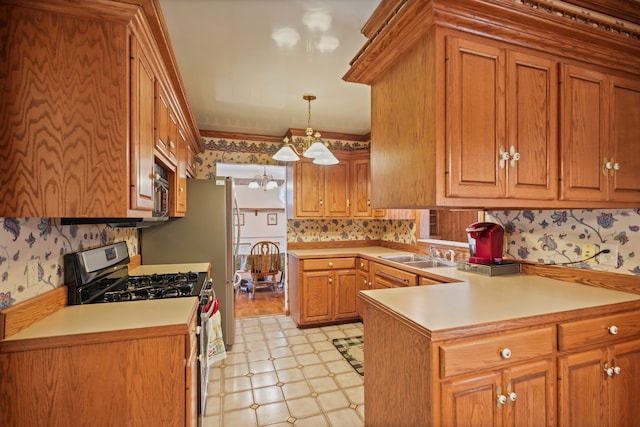 kitchen featuring an inviting chandelier, light floors, brown cabinets, a sink, and stainless steel appliances