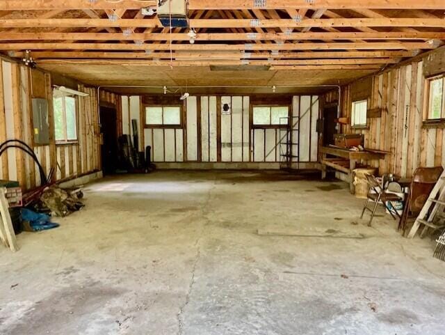 238 Maple St, Bitely, MI 49309 - misc room with electric panel and a garage