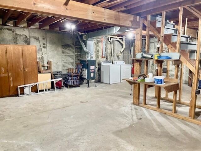 238 Maple St, Bitely, MI 49309 - unfinished below grade area featuring independent washer and dryer and heating unit