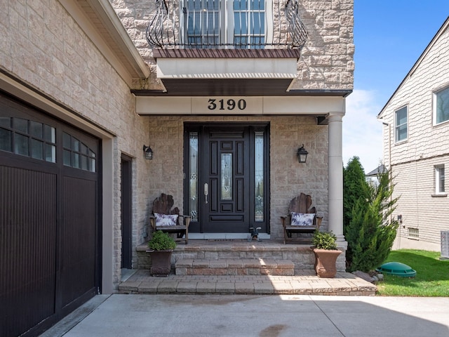 3190 Edgewood Park Dr, Commerce Twp, MI 48382 - doorway to property with central air condition unit and stone siding