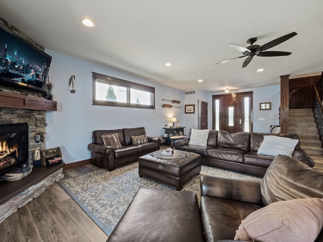 3190 Edgewood Park Dr, Commerce Twp, MI 48382 - living room with a stone fireplace, a ceiling fan, recessed lighting, wood finished floors, and visible vents