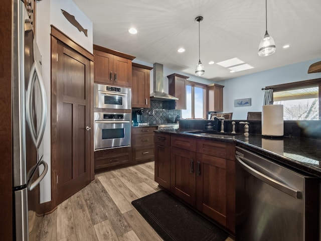3190 Edgewood Park Dr, Commerce Twp, MI 48382 - kitchen with a sink, a wealth of natural light, wall chimney range hood, and stainless steel appliances