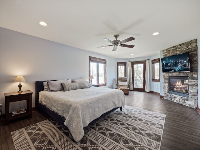 3190 Edgewood Park Dr, Commerce Twp, MI 48382 - bedroom featuring wood finished floors, a fireplace, access to exterior, baseboards, and ceiling fan