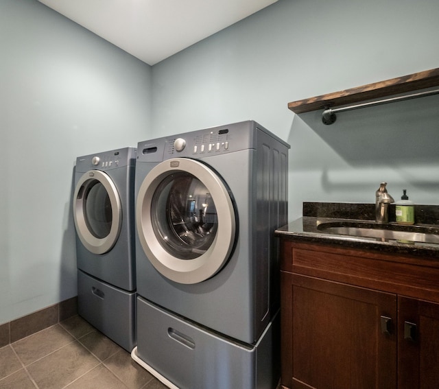 3190 Edgewood Park Dr, Commerce Twp, MI 48382 - laundry area with cabinet space, a sink, baseboards, tile patterned floors, and separate washer and dryer