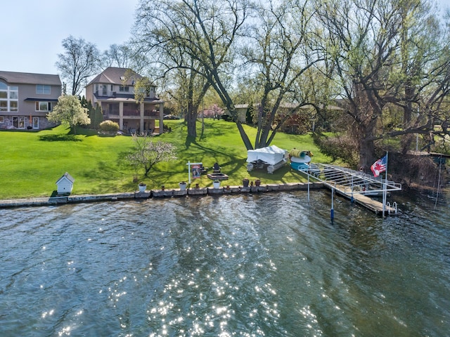 3190 Edgewood Park Dr, Commerce Twp, MI 48382 - dock area featuring a lawn and a water view