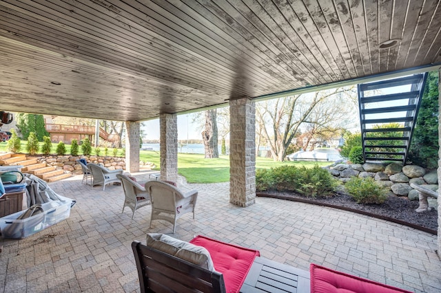 3190 Edgewood Park Dr, Commerce Twp, MI 48382 - view of patio with a water view, an outdoor living space, and stairway