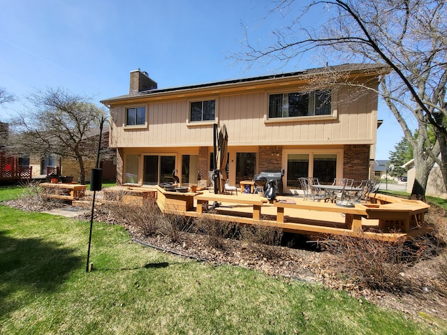6358 Timberwood S, West Bloomfield, MI 48322 - back of house with brick siding, a chimney, outdoor dining area, and a patio area