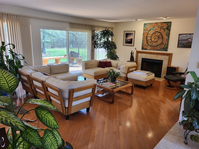 6358 Timberwood S, West Bloomfield, MI 48322 - living area with a tiled fireplace and hardwood / wood-style floors