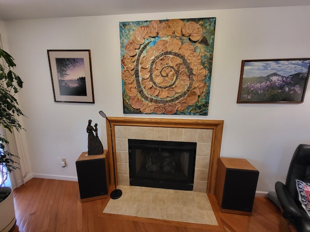 6358 Timberwood S, West Bloomfield, MI 48322 - details with baseboards, wood finished floors, and a tiled fireplace