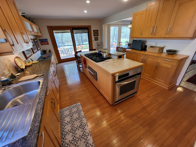 6358 Timberwood S, West Bloomfield, MI 48322 - kitchen featuring butcher block counters, oven, recessed lighting, a sink, and black gas cooktop