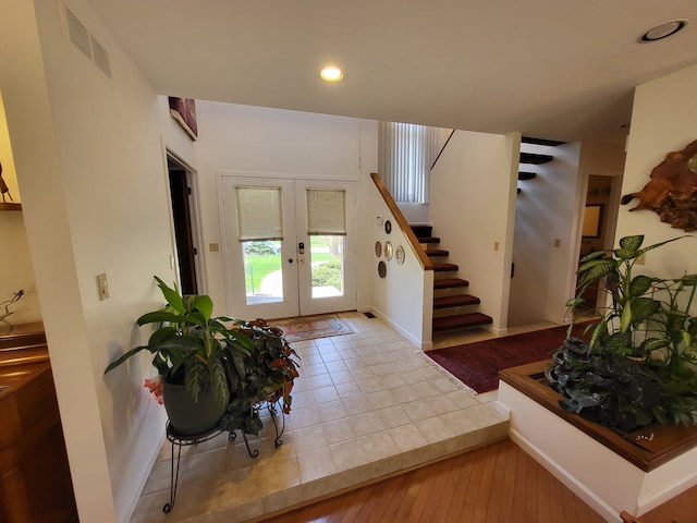 6358 Timberwood S, West Bloomfield, MI 48322 - foyer featuring visible vents, hardwood / wood-style floors, stairway, recessed lighting, and french doors