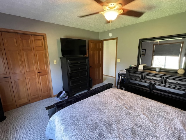 331 Jonesville Rd, Jonesville, MI 49250 - carpeted bedroom featuring a closet, a textured ceiling, and ceiling fan