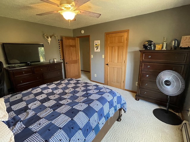331 Jonesville Rd, Jonesville, MI 49250 - bedroom with light colored carpet, a ceiling fan, a textured ceiling, and a baseboard heating unit
