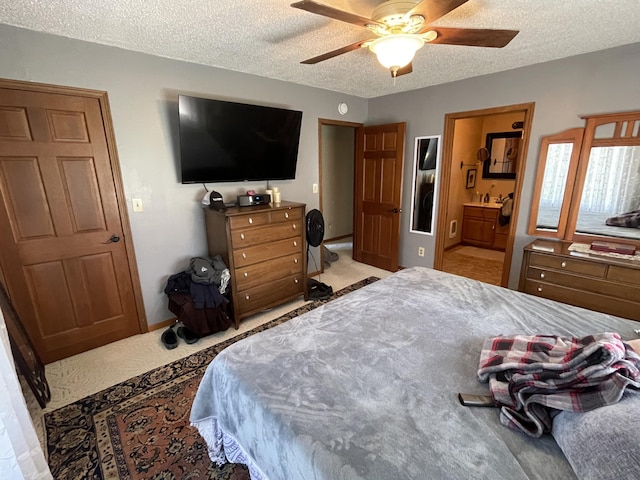 331 Jonesville Rd, Jonesville, MI 49250 - bedroom featuring carpet floors, a textured ceiling, ceiling fan, and ensuite bath