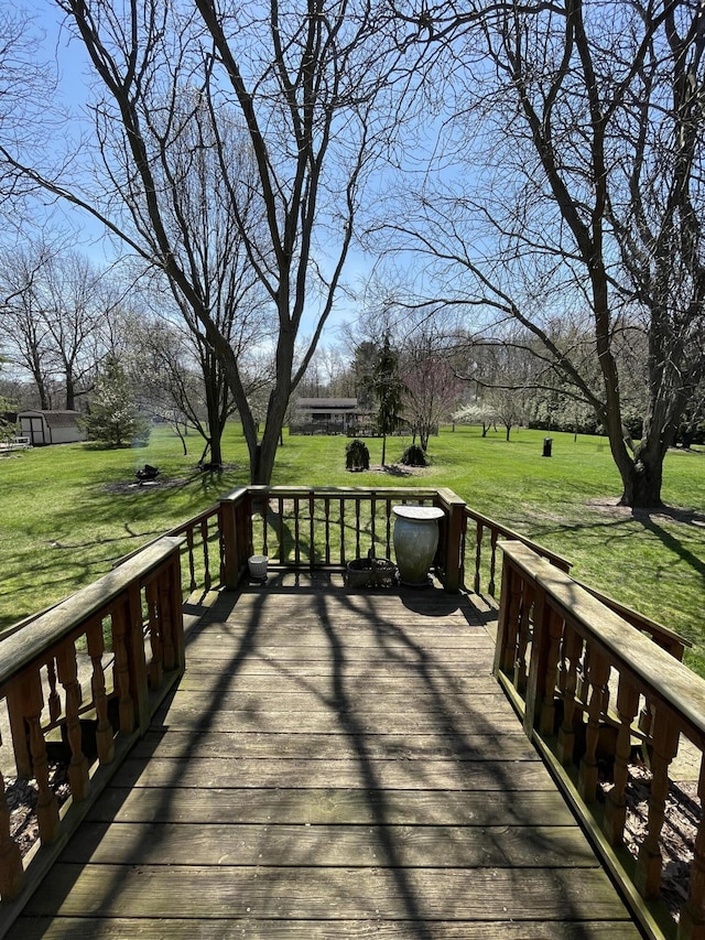 331 Jonesville Rd, Jonesville, MI 49250 - wooden deck featuring a lawn