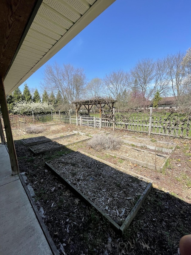 331 Jonesville Rd, Jonesville, MI 49250 - view of yard featuring fence and a vegetable garden