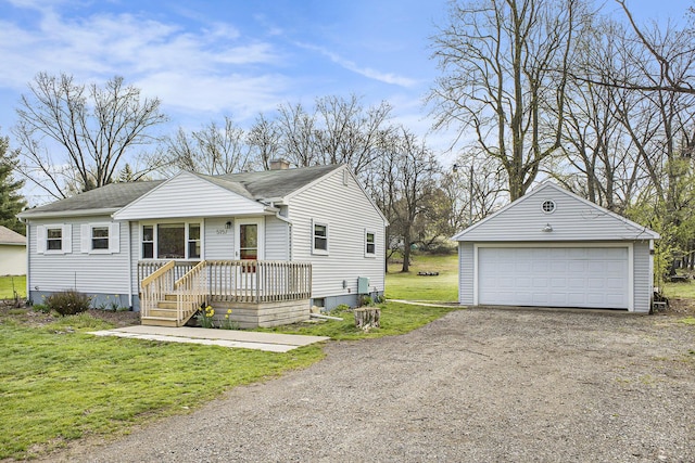 view of front of home featuring a chimney, an outdoor structure, a shingled roof, a garage, and a front yard