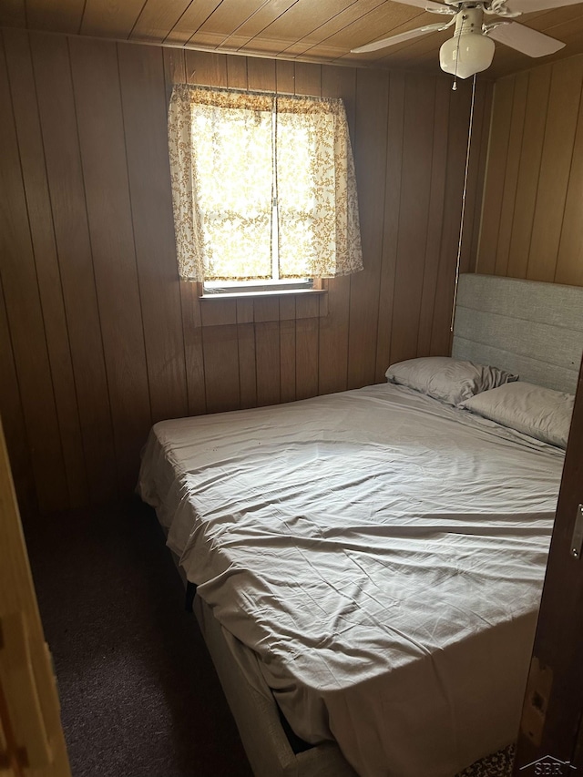 2934 River Ridge Rd, Alger, MI 48610 - bedroom featuring a ceiling fan, wooden ceiling, and wood walls