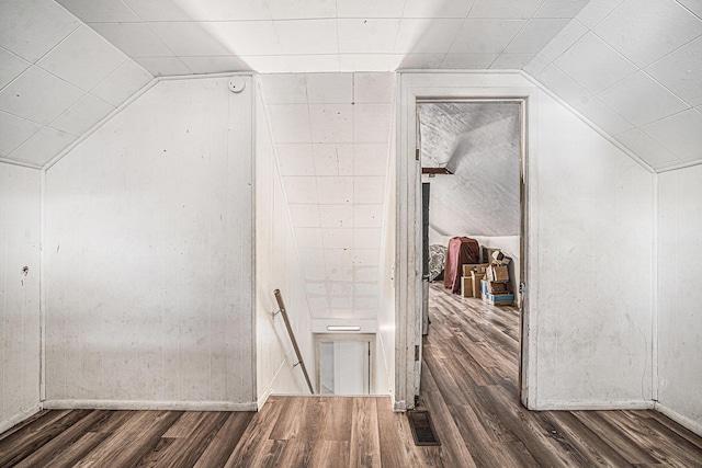 bonus room with visible vents, wood finished floors, and vaulted ceiling