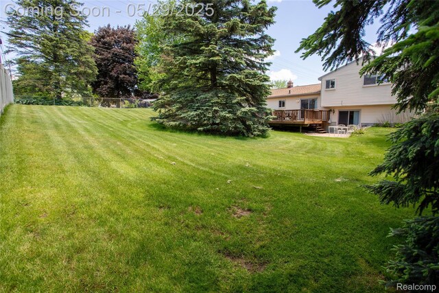 140 Indian Knolls St, Oxford, MI 48371 - view of yard featuring a deck