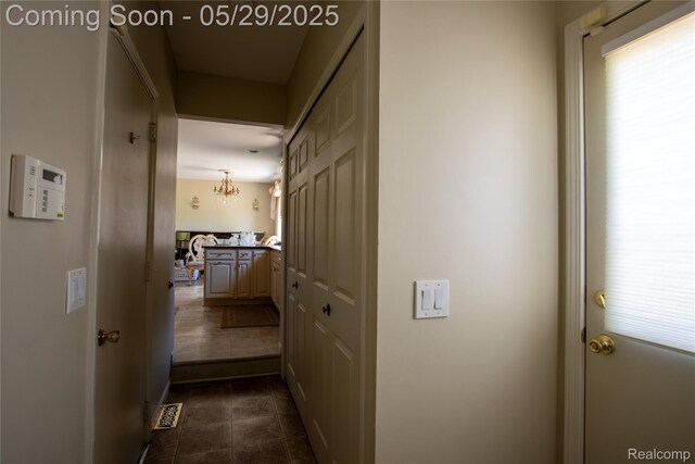 140 Indian Knolls St, Oxford, MI 48371 - hall featuring dark tile patterned flooring