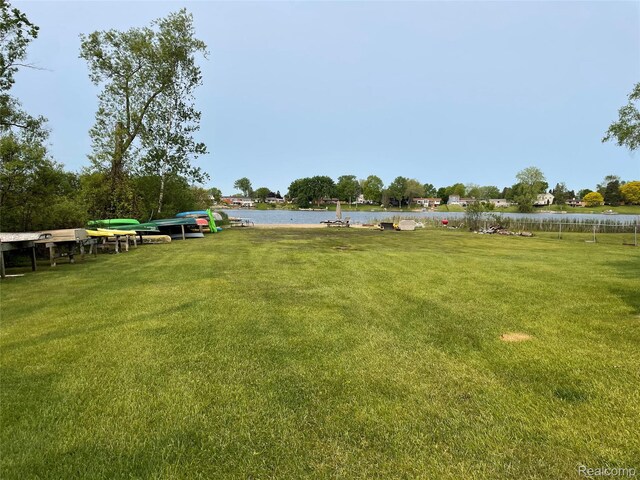 140 Indian Knolls St, Oxford, MI 48371 - view of grassy yard with a water view