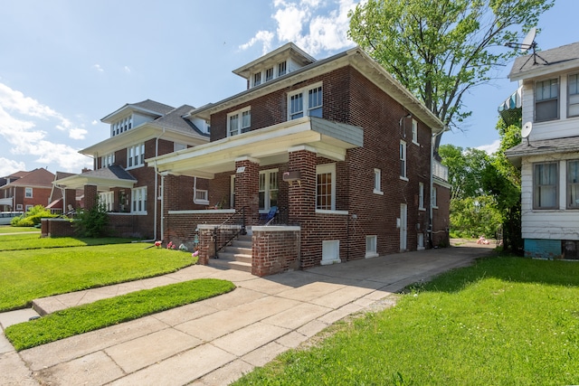 214 Worcester, Highland Park, MI 48203 - traditional style home with brick siding, a front yard, and a porch