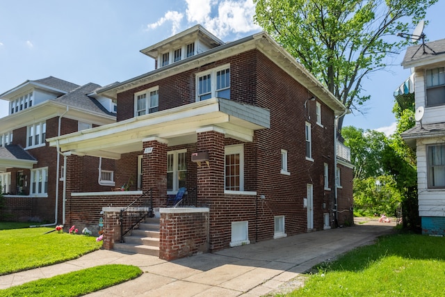 214 Worcester, Highland Park, MI 48203 - traditional style home with brick siding, a porch, and a front lawn