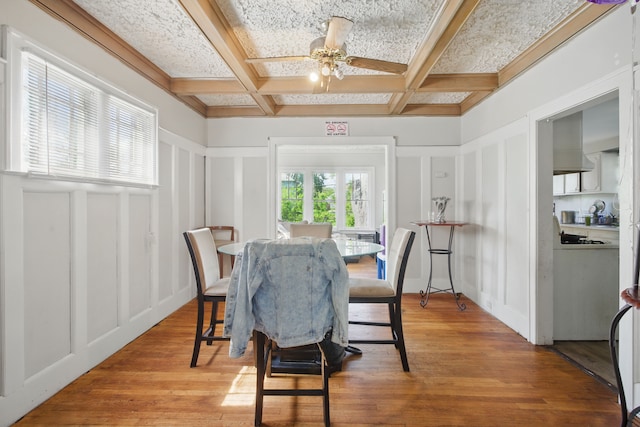 214 Worcester, Highland Park, MI 48203 - dining room featuring a decorative wall, coffered ceiling, a ceiling fan, beam ceiling, and light wood-style floors