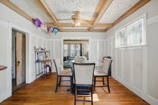 214 Worcester, Highland Park, MI 48203 - dining area featuring a decorative wall, coffered ceiling, a ceiling fan, wood finished floors, and beamed ceiling