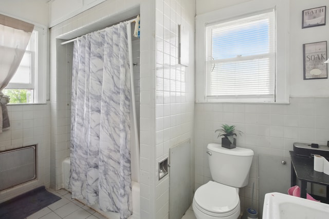 214 Worcester, Highland Park, MI 48203 - bathroom featuring tile walls, shower / bath combo with shower curtain, toilet, and tile patterned flooring