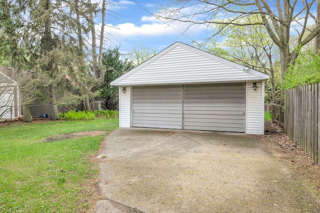 detached garage featuring fence