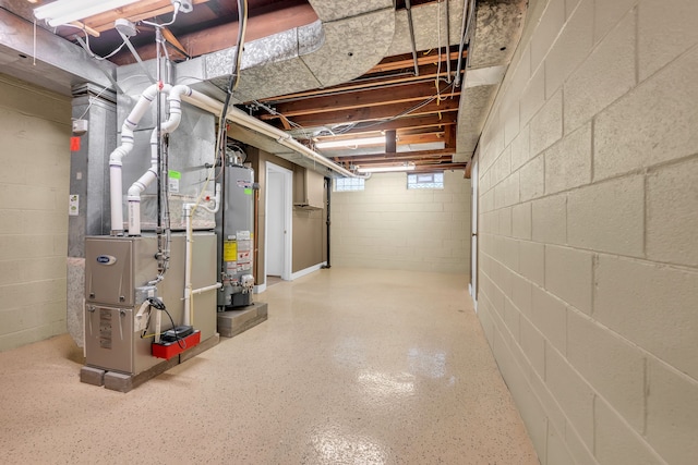 below grade area featuring heating unit and water heater