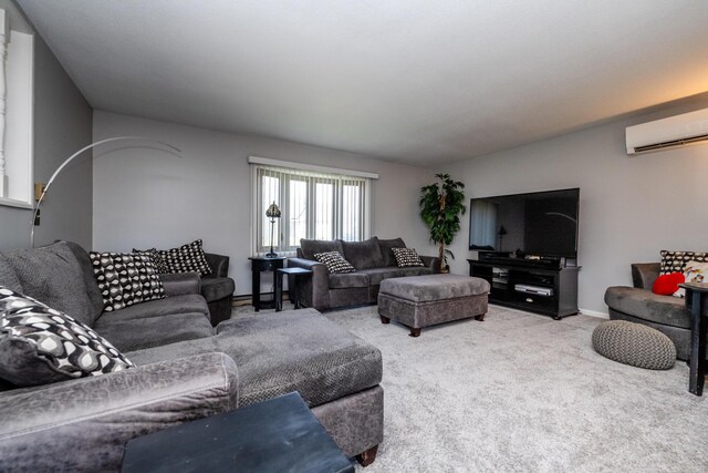carpeted living room featuring a wall mounted air conditioner and baseboards