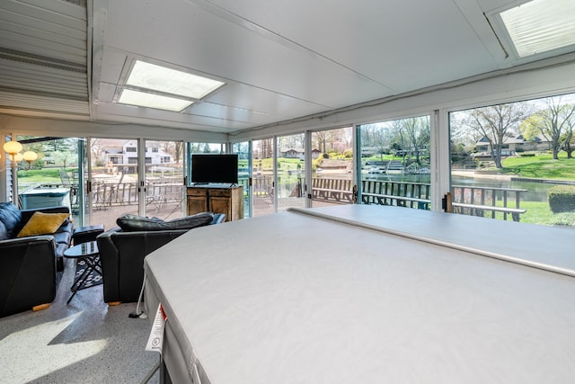 sunroom featuring speckled floor